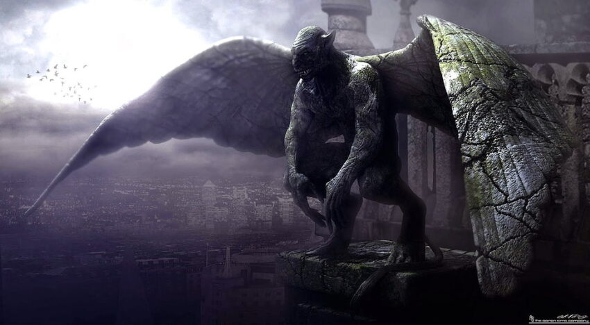 A stone gargoyle on the top of some kind of ancient structure. Cracks in the stone gives the impression that the wings are spreading as if the creature was awakening.